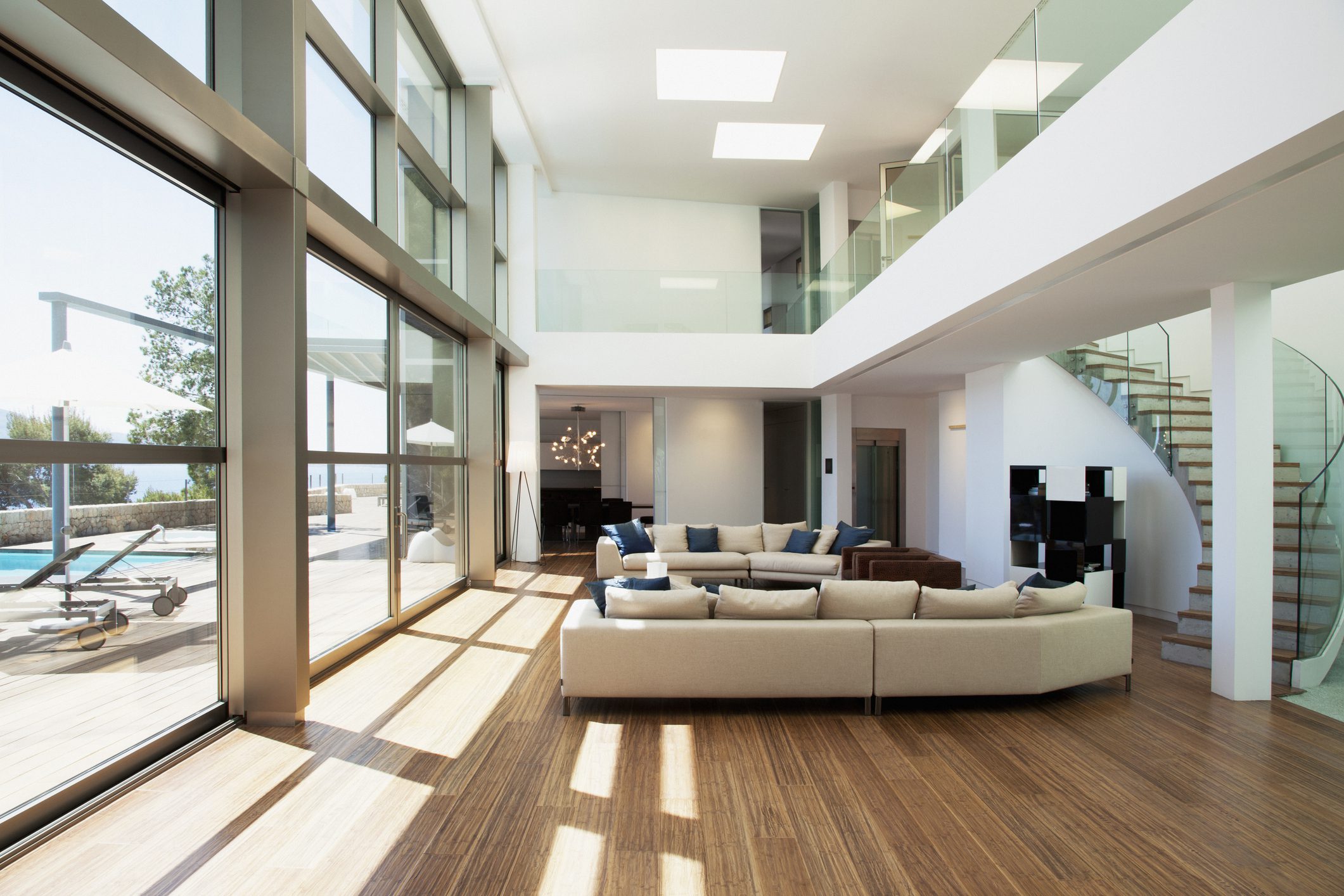 Spacious modern living room with large windows.
